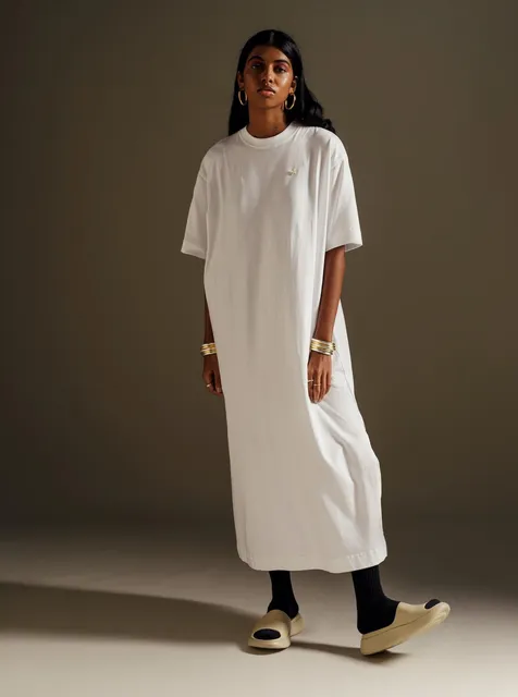 A woman in a white cotton midi dress